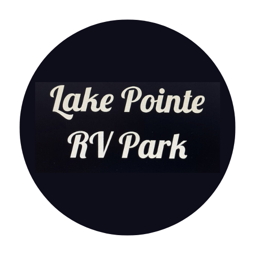 White text reads "Lake Pointe RV Park" in a cursive font, centered on a black circular background.
